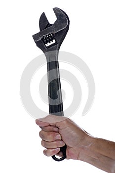 Adjustable spanner in hand isolated
