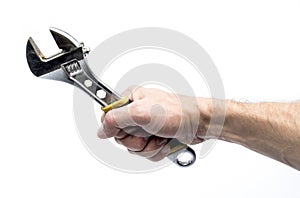 Adjustable spanner in hand on a white background