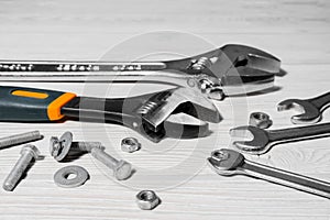Adjustable spanners and wrenches, nuts and bolts on the table