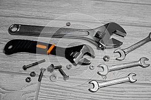Adjustable spanners and wrenches, nuts and bolts on the table