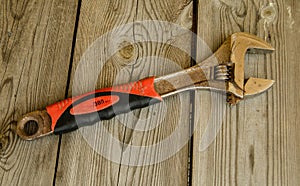 Adjustable wrench with red rubberized handle,  on white