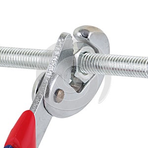 Adjustable wrench spanner tightening a nut on a bolt