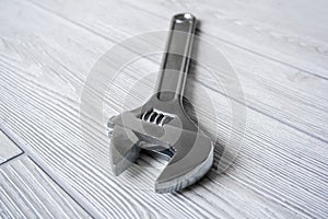 Adjustable wrench on the table close up