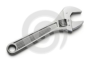Adjustable wrench tool on a white surface