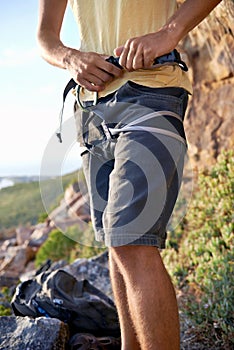 Adjusting his harness