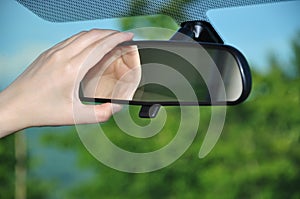 Adjusting rear view mirror