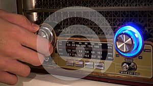 Adjusting the volume knob of the retro radio