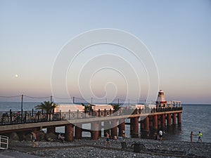 Adler city/ Russia - August 2019: Sunset, Lighthouse in the seafront of Adler city