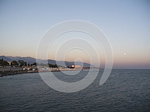 Adler city/ Russia - August 2019: Sunset under the seafront of Adler city