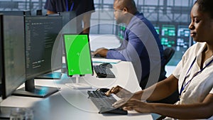 Admin using isolated screen tablet, working in server farm