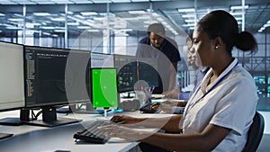 Admin using isolated screen tablet, working in server farm