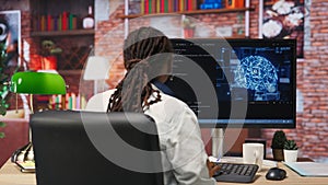 Admin writing artificial intelligence code on computer