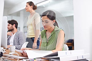 Administration, coworking space and woman at desk with document, reading and small business. Computer, office and female