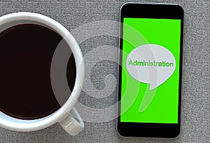 Administration, message on speech bubble with smart phone and and coffee