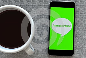 Administration, message on speech bubble with smart phone and and coffee photo