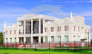 Administrative building of two stories high, white, with columns