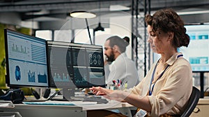 Administrator engages with financial data insights on a computer