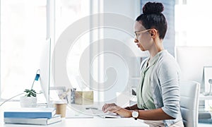 Administrator, working and business woman on computer thinking, planning and schedule for company on technology