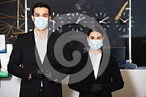 administrators in medical masks and latex
