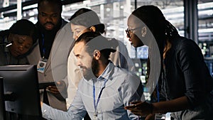 Admins doing brainstorming in server hub, reviewing machine learning code