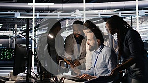 Admins doing brainstorming in server hub, reviewing machine learning code