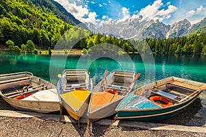 Admirable alpine landscape with colorful boats, Lake Fusine, Italy, Europe