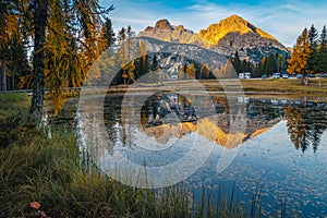 Admirable autumn sunrise landscape with Antorno lake in Dolomites, Italy photo