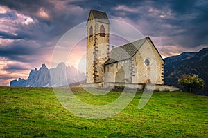 St Jakob church at sunrise in Funes valley, Dolomites, Italy photo