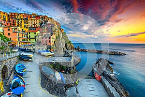 Superb harbor and village at sunset, Manarola, Cinque Terre, Italy photo