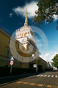 The Admiralty building in St.Petersburg, Russia with nymphs holding globes and empty street in sunny summer day