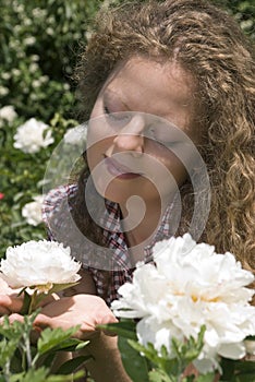 Admiring a peony flower