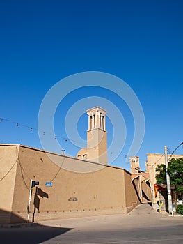 An adobe architecture on Alvavi street on blue sky in Kashan Ira