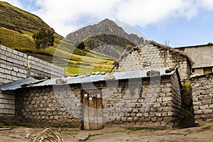 Adobe house with a zinc roof around Zumbahua photo