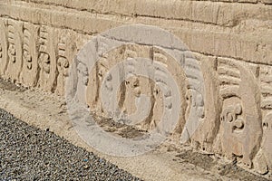 Adobe walls and decorations in the archaeological site of Chan Chan made by the Chimu civilization near Trujillo, Peru