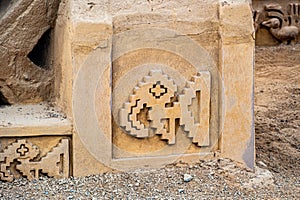 adobe walls and decorations in the archaeological site of Chan Chan made by the Chimu civilization near Trujillo, Peru