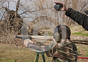 Adolescent Boy Shooting Pistol