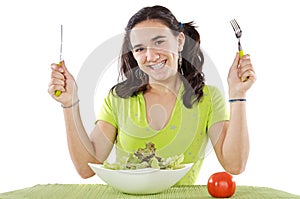 Adolescent eating a salad