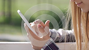 Adolescent Girl Browsing Internet on Smart Phone in Park, Young Kid Playing Smartphone, Teenager Child use Devices Outdoor