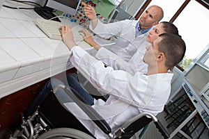 Adolescents in science class one in wheelchair