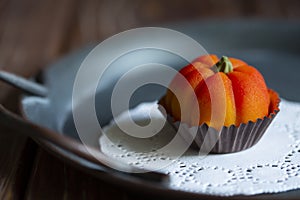 Adorabe fall edible pumpkin made with marzipan on vintage tray