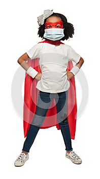 Adorable African American Young Girl Wearing a Super Hero Costume and a Surgical Mask