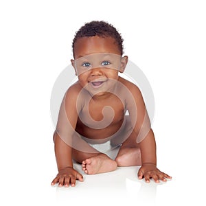 Adorable african baby in diaper sitting on the floor