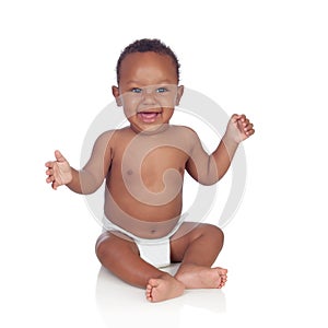 Adorable african baby in diaper sitting on the floor photo