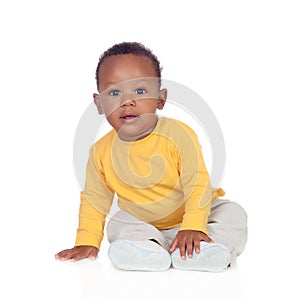 Adorable african baby sitting on the floor