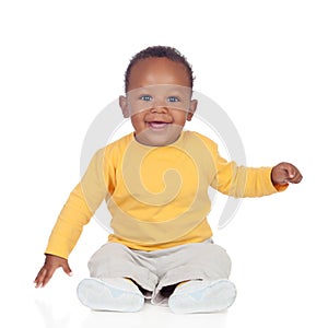 Adorable african baby sitting on the floor