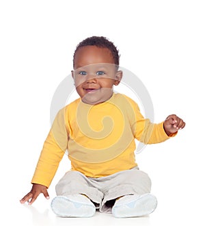 Adorable african baby sitting on the floor