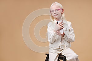 Adorable albino girl with charming appearance take photo