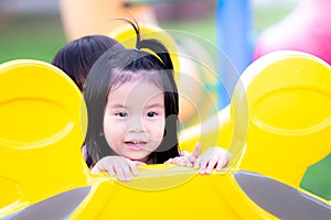 Adorable Asian child girl playing 