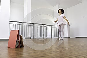 Adorable asian girl having ballet class through online method