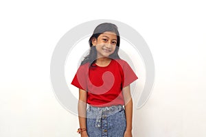 Adorable asian little girl standing while smiling. Isolated on white backgound